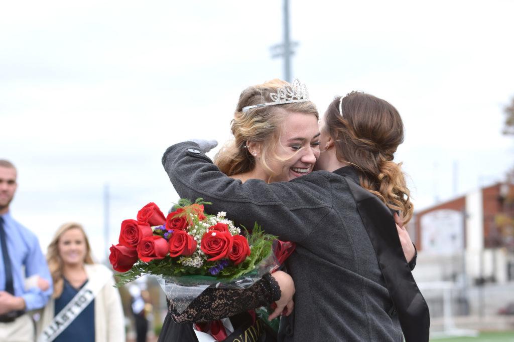 Jessica McCandless hugs the new queen, Rachel Mobley